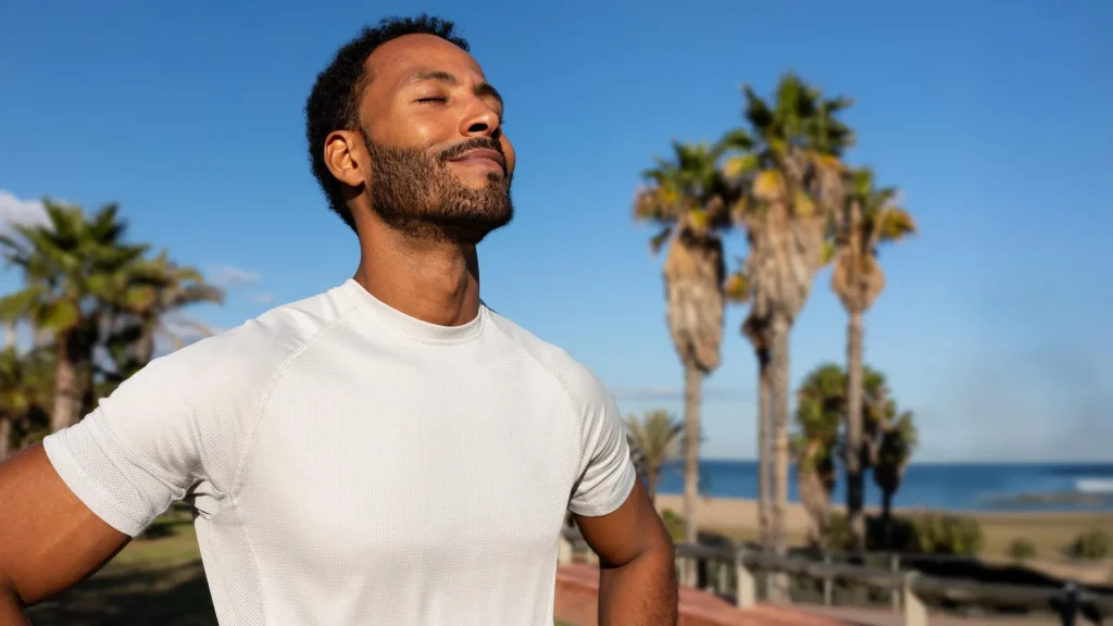 african-american-man-breathing-deeply-in-summer-sun